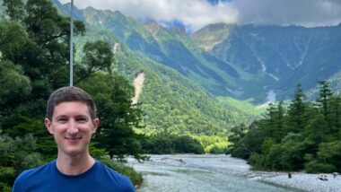 man overlooking the Japanese alps of Kamikochi