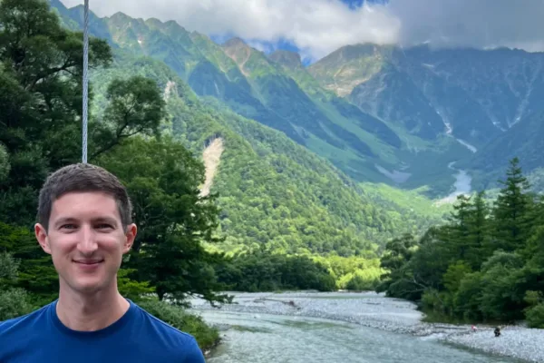 man overlooking the Japanese alps of Kamikochi