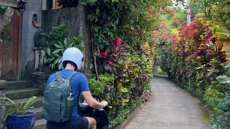 Digital Nomad in Bali riding a motorbike to a coworking space