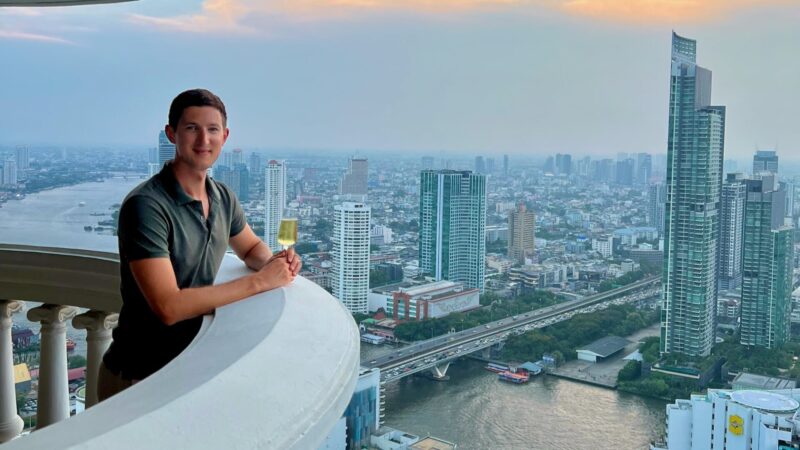 views of city skyline along river in Bangkok Thailand