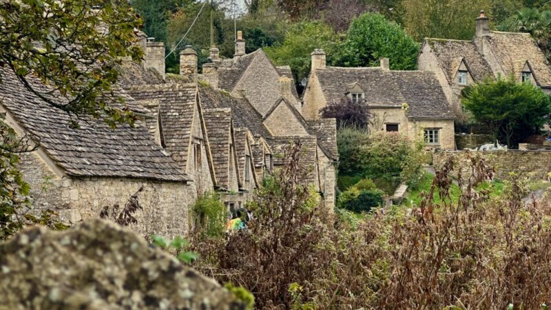 Bibury in the Costwolds, one of the best places to visit in Europe in Autumn