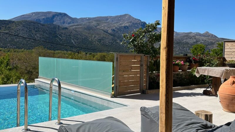 views of mountains, windmills, and sheep from where to stay in Crete