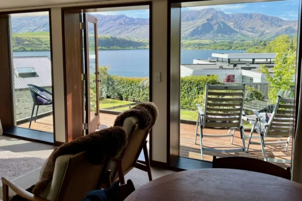 views of Lake Hayes and snow capped mountains from luxury apartment, in one of the best places for where to stay in queenstown
