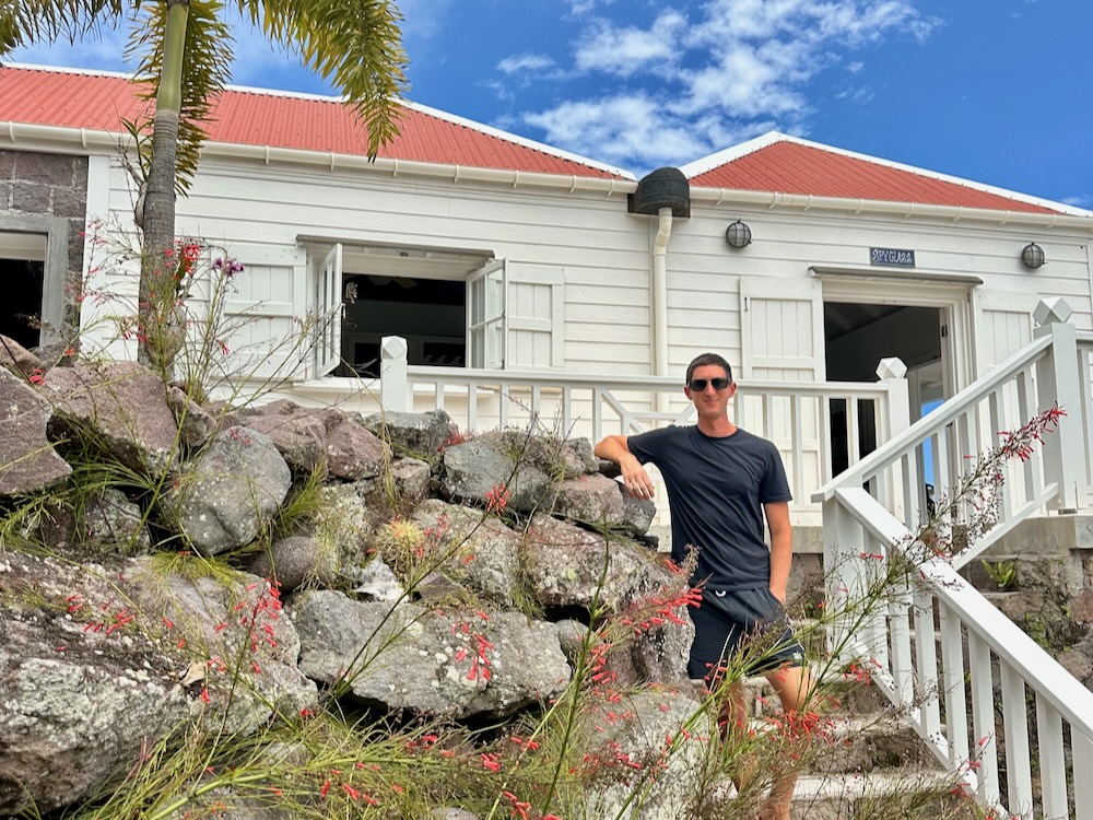 travel blogger standing in front of luxury Spyglass Villa on Saba Caribbean island