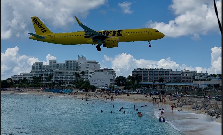 plane landing at Maho beach in St. Maarten