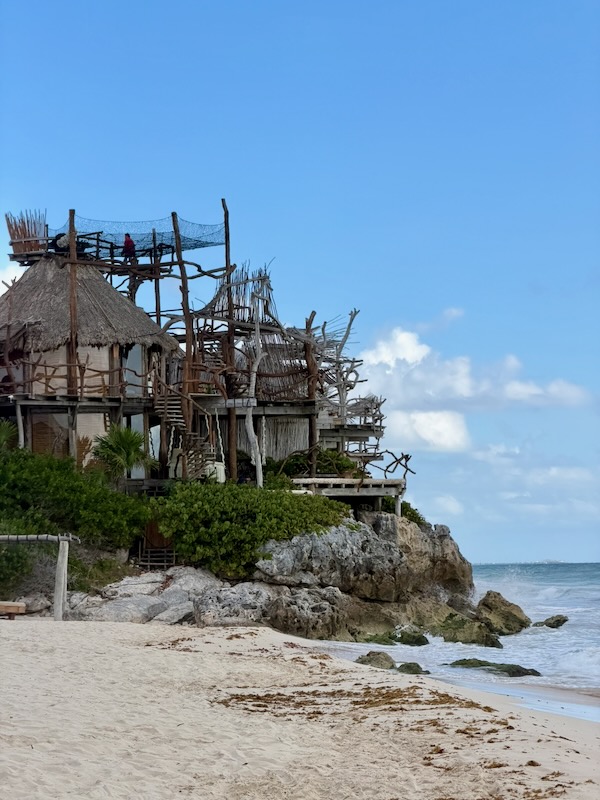 Beachside wooden structures on cliff