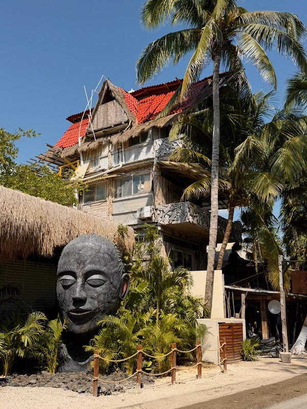 Tropical building with palm trees.