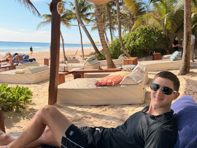 Relaxing beach scene with lounge chairs.